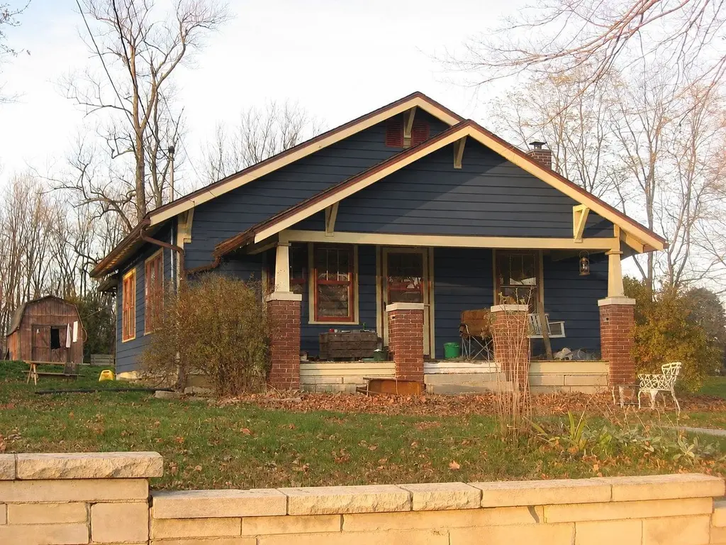 Sample house redone in navy lap siding